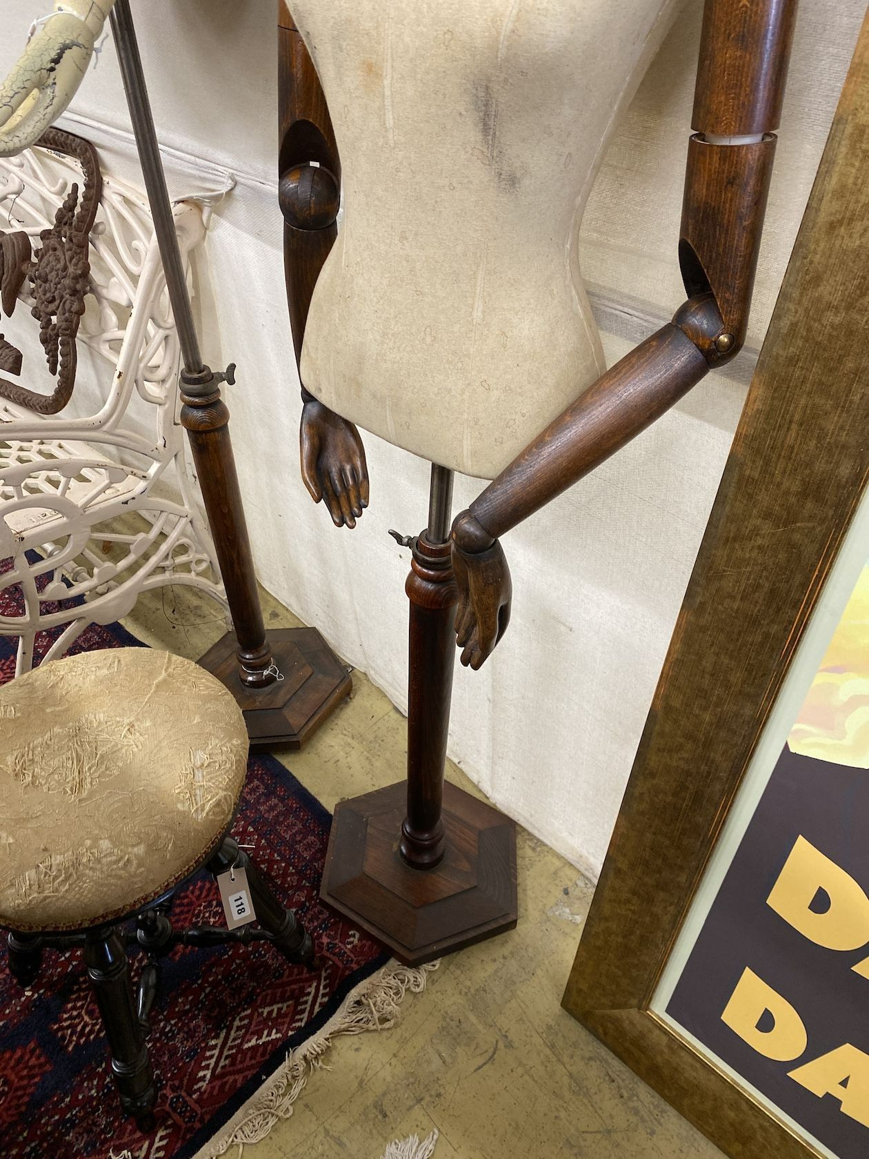 A Victorian style stained beech mannequin on telescopic stand